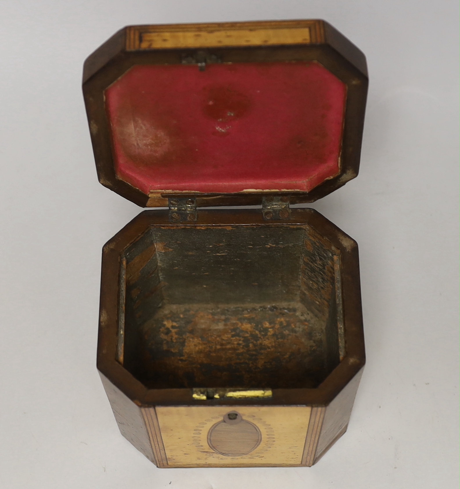 A George III sycamore and rosewood octagonal tea caddy, 13cm